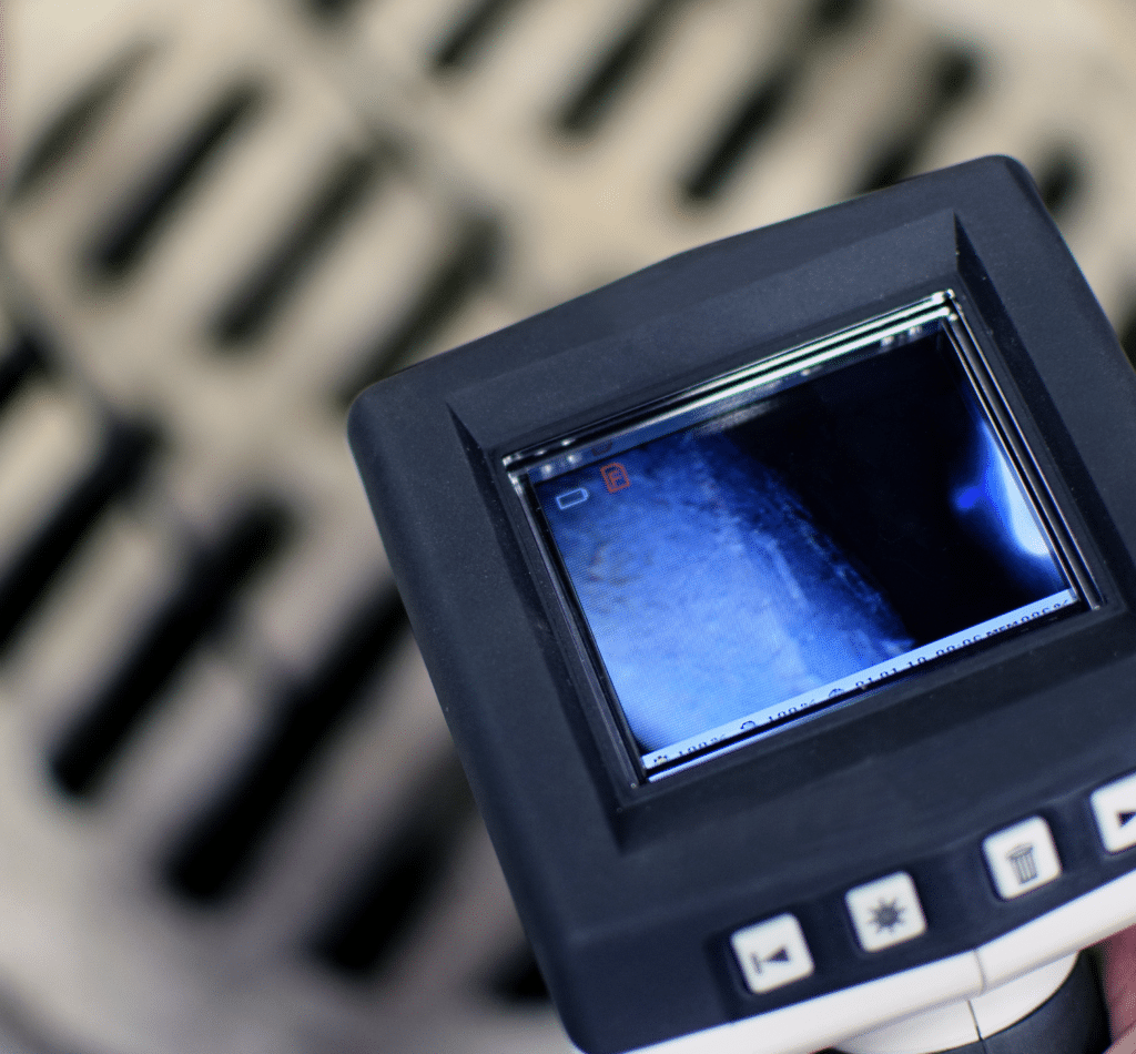 Sewer Camera Inspection Screen with a view down a dewer drain